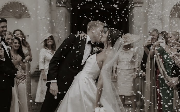 The couple leaving after the ceremony
